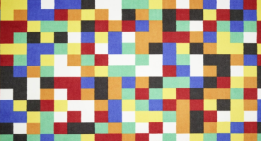 „Abstrakter Vorwerk Teppich mit bunt gemischtem Pixelmuster aus rechteckigen Farbflächen in Rot, Blau, Gelb, Grün, Orange, Schwarz und Weiß; geometrisch angeordnet ohne erkennbare Wiederholung.“